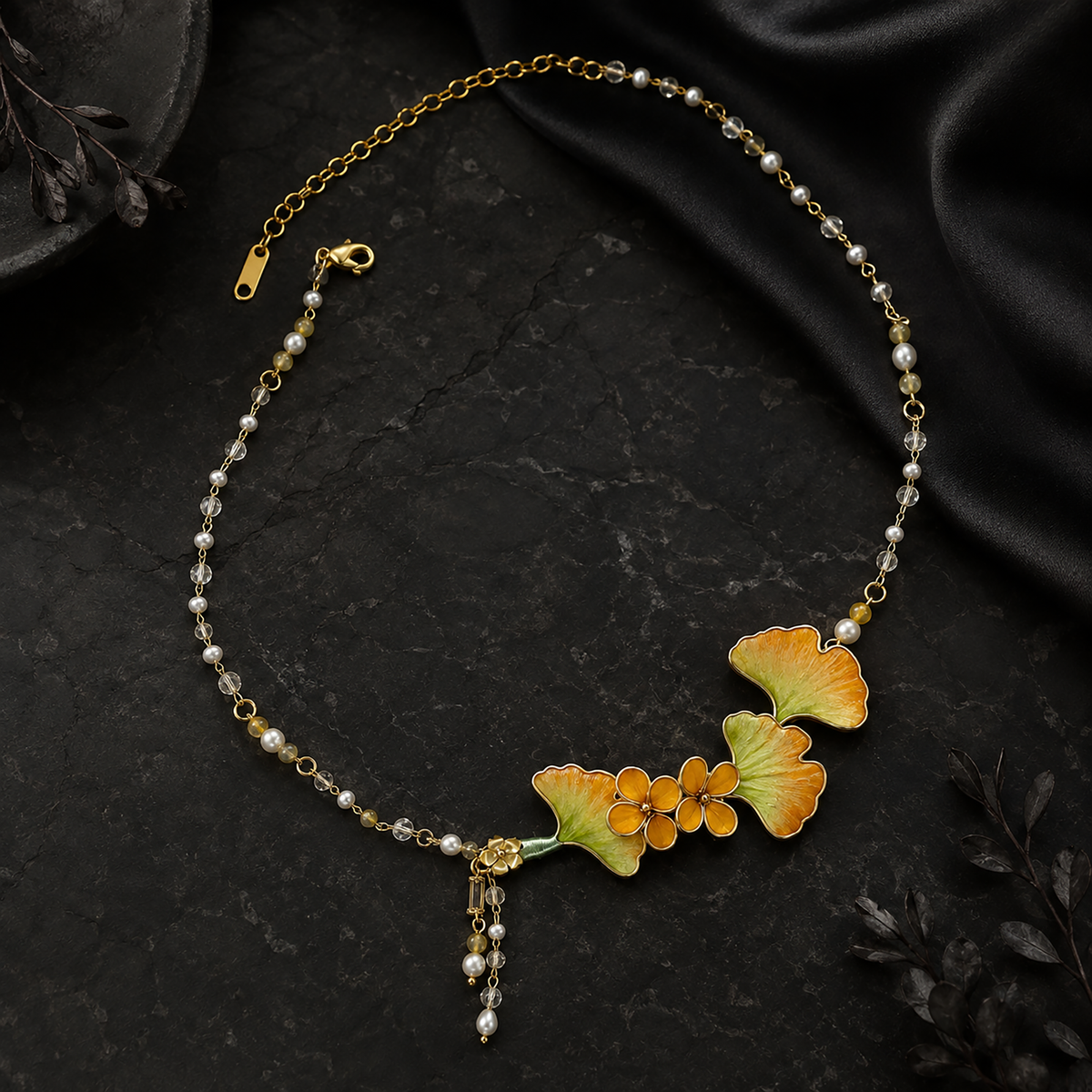 Ginkgo leaf necklace showing shell and pearl details
