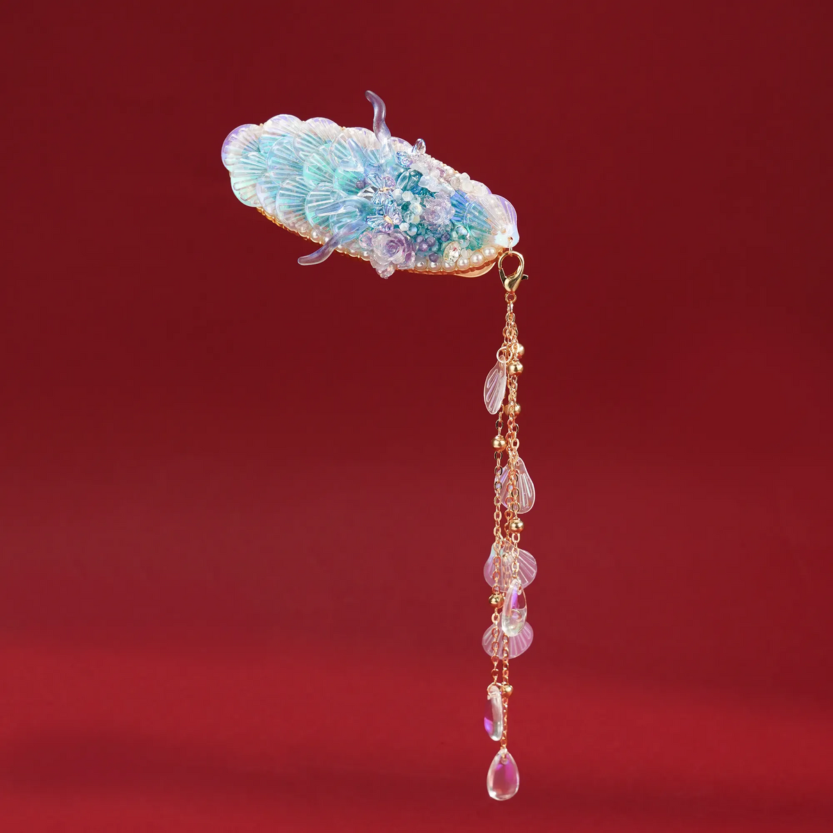 Ao Bing Dragon Hair Clip with pendant detail on a red background