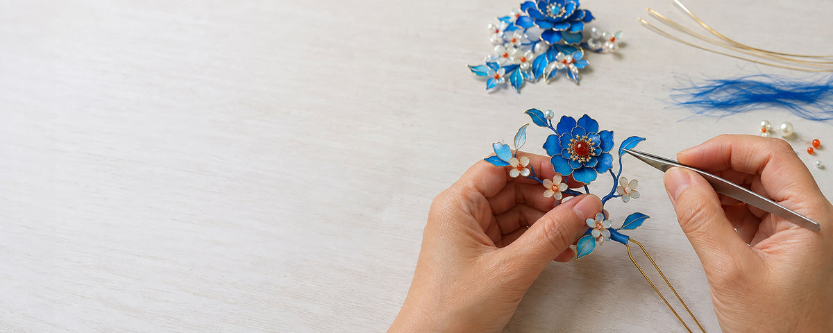 Artisan shaping a handcrafted Chinese decorative flower for CLMADE