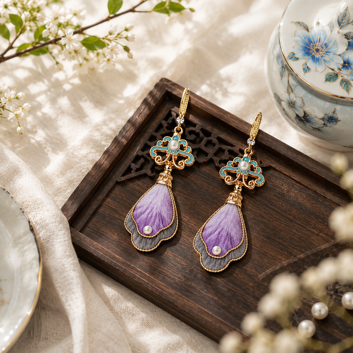 Twilight Cloud Mountain silk velvet earrings displayed on a wooden tray