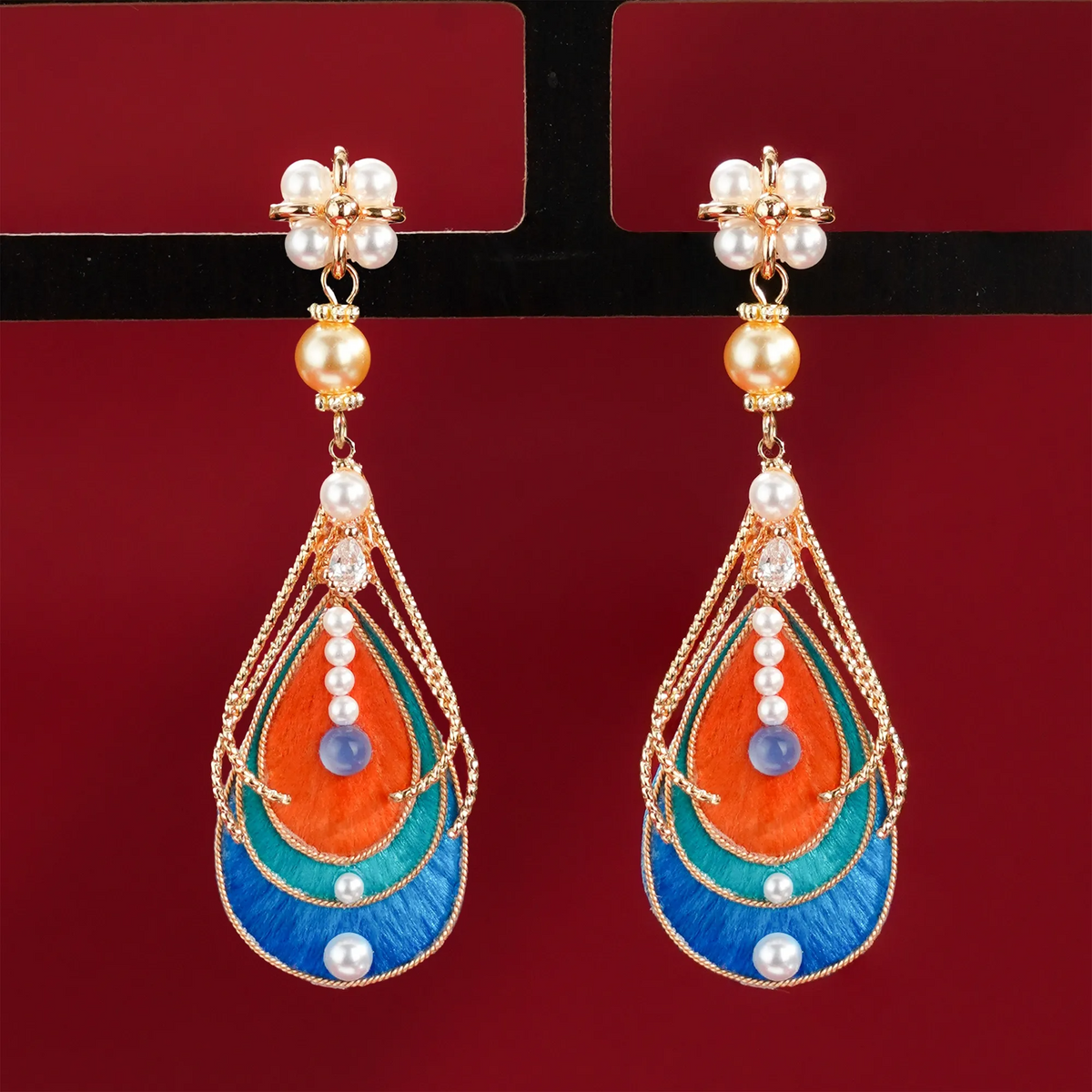 Pair of Dunhuang-inspired Ronghua drop earrings with layered silk-fibre teardrops