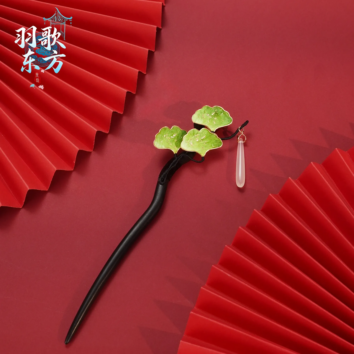 Green Ginkgo Ronghua Hairpin full view on a red background
