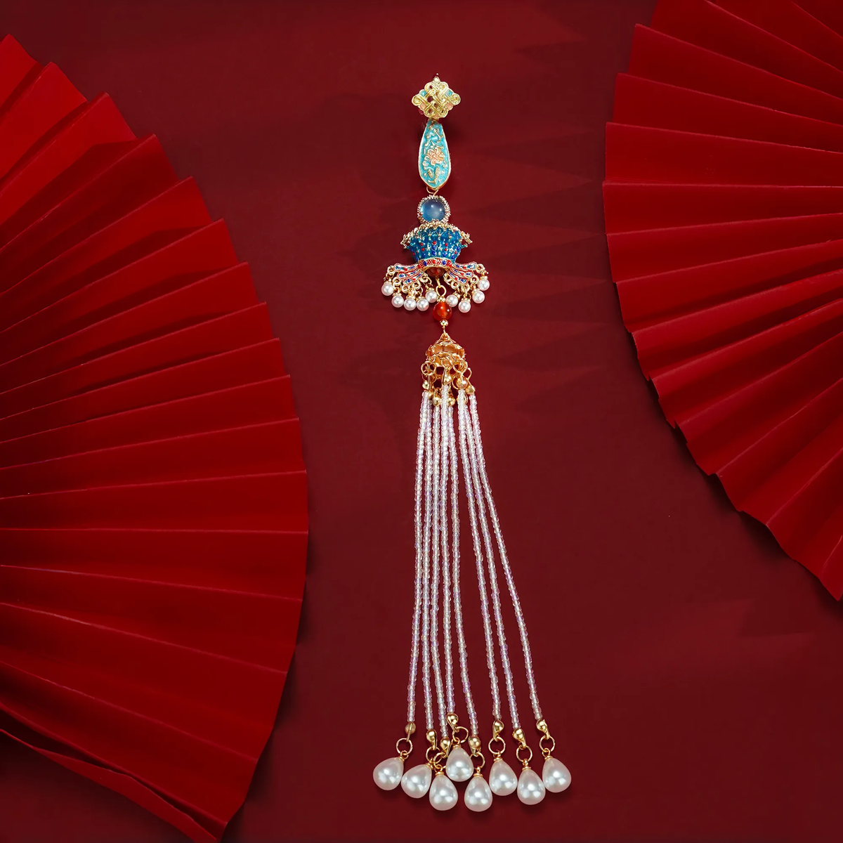 Nine Dragons and Nine Phoenixes Qipao Brooch with long tassel on a red background