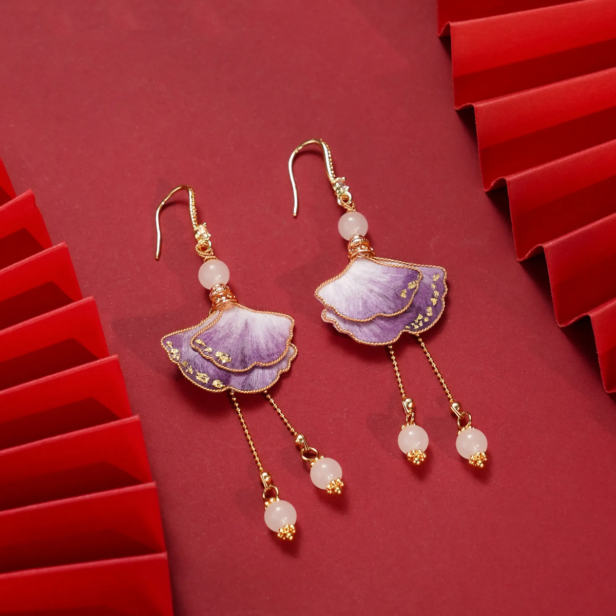 Close view of fish-hook fittings and layered purple ginkgo silk-fibre leaves