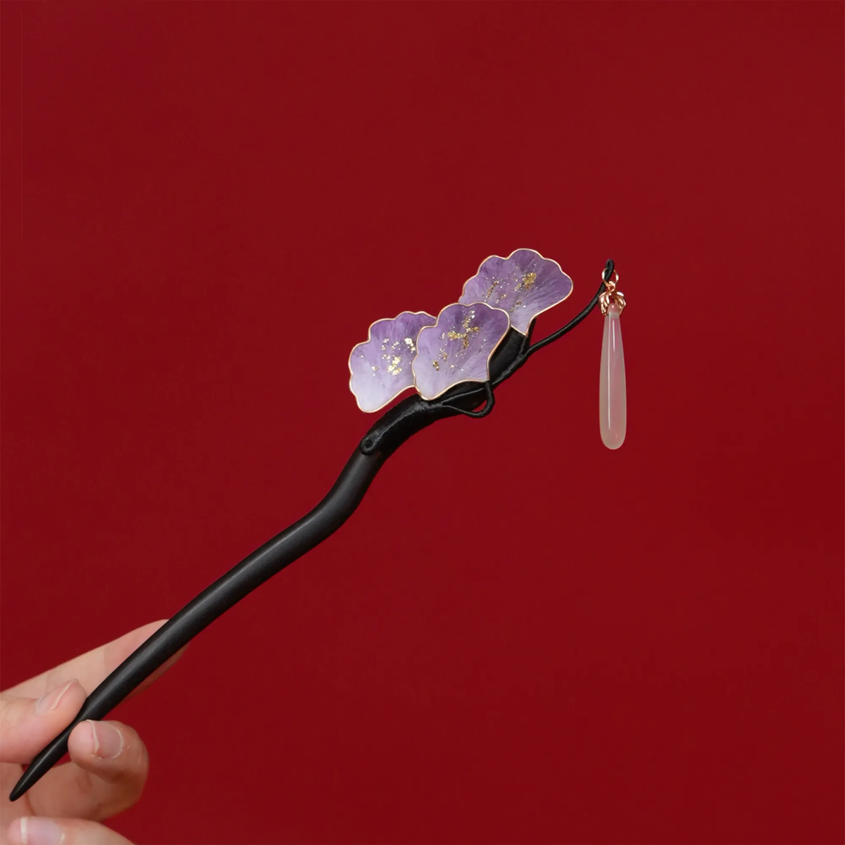 Purple Ginkgo Ronghua Hairpin on a styled background